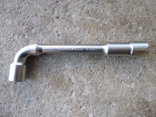 Cle pipe debouchee - a,