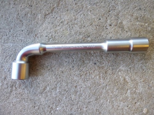 Cle pipe debouchee - a,